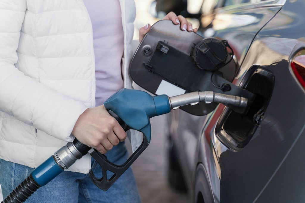 Woman Filling Up Car Gas Station