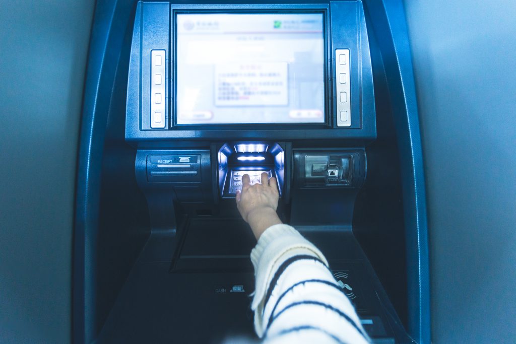 Woman Using Cash Machine Atm,close Up View